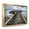 Designart 16-in x 32-in Wooden Pier on North Irish Coastline with Gold Wood Framed Canvas