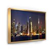 Designart 18-in x 34-in New York Skyline at Night with Gold Wood Framed Canvas Wall Panel