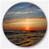 Designart 36-in x 36-in Round Red Sunset with Dark Ocean Waves' Seascape Metal Circle Wall Art