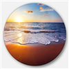 Designart 11-in x 11-in Round Stunning Blue Waves and Brown Sand' Beach Photo Metal Circle Art