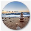 Designart 36-in x 36-in Stones Balance on Sandy Beach Seashore Metal Circle Wall Art